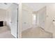 Hallway with carpet flooring, neutral paint, and ample closet space at 12710 Buffalo Run Drive, Gibsonton, FL 33534