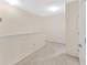 Bright hallway with neutral paint, carpet flooring, and natural light coming from a nearby window at 12710 Buffalo Run Drive, Gibsonton, FL 33534
