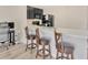 Bright kitchen featuring a breakfast bar with seating, sleek countertops and stainless steel sink at 12710 Buffalo Run Drive, Gibsonton, FL 33534