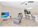 Open-concept living room and kitchen area with modern furniture, and lots of natural light at 12710 Buffalo Run Drive, Gibsonton, FL 33534