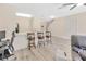 Open living space featuring kitchen with bar stools and living area with ceiling fan at 12710 Buffalo Run Drive, Gibsonton, FL 33534