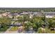 Aerial view showcasing the home surrounded by lush trees in a picturesque neighborhood at 1327 S Michigan Ave, Clearwater, FL 33756