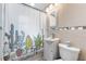 This modern bathroom features a sleek vanity, stylish shower, and a clean, bright design at 1327 S Michigan Ave, Clearwater, FL 33756