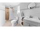 Bright bathroom featuring modern fixtures, neutral tiling, and a sleek, glass-enclosed shower stall at 1327 S Michigan Ave, Clearwater, FL 33756