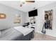 This comfortable bedroom features a ceiling fan, natural light, and sleek design for comfortable living at 1327 S Michigan Ave, Clearwater, FL 33756