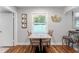 Bright dining area features modern decor and sleek bamboo floors, perfect for cozy meals at 1327 S Michigan Ave, Clearwater, FL 33756