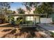 Charming single-story home featuring tidy landscaping and a covered front porch, exuding curb appeal at 1327 S Michigan Ave, Clearwater, FL 33756