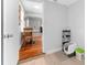 A bright hallway featuring tile and hardwood flooring connecting to the rest of the house at 1327 S Michigan Ave, Clearwater, FL 33756