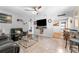 Cozy living room with tile flooring, modern furnishings, and an entertainment center at 1327 S Michigan Ave, Clearwater, FL 33756