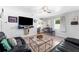Spacious living room with tile flooring, modern furniture, and a comfortable seating arrangement at 1327 S Michigan Ave, Clearwater, FL 33756