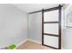 Bright room featuring a wood-framed sliding door, wood-look floors, and neutral paint at 1327 S Michigan Ave, Clearwater, FL 33756