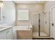 Bathroom featuring a soaking tub and glass shower at 13310 Tiger Lilly Ln, Tampa, FL 33625