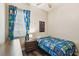 Bright bedroom featuring Minecraft-themed bedding, decor, and wood-look flooring at 13310 Tiger Lilly Ln, Tampa, FL 33625