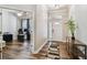 Welcoming foyer features wood-look floors and a convenient console table with stylish decor at 13310 Tiger Lilly Ln, Tampa, FL 33625