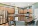 Stylish kitchen with stainless steel appliances and a large center island at 13310 Tiger Lilly Ln, Tampa, FL 33625