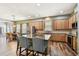 Well-equipped kitchen with an island and a view into living room at 13310 Tiger Lilly Ln, Tampa, FL 33625