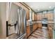 Modern kitchen featuring stainless steel appliances and wood flooring at 13310 Tiger Lilly Ln, Tampa, FL 33625