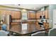 Gourmet kitchen features granite counters and modern stainless steel appliances at 13310 Tiger Lilly Ln, Tampa, FL 33625