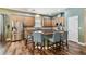 Kitchen featuring stainless steel appliances, island, and wood floors at 13310 Tiger Lilly Ln, Tampa, FL 33625