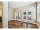 Bright living room with French doors, offering views of the backyard at 13310 Tiger Lilly Ln, Tampa, FL 33625