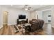 Spacious living area with a ceiling fan and ample room for relaxation and entertainment at 13310 Tiger Lilly Ln, Tampa, FL 33625