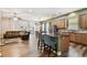 Open-concept living room and kitchen features a breakfast bar and ample natural light at 13310 Tiger Lilly Ln, Tampa, FL 33625