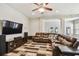 Spacious living room with a large sectional sofa, and media center at 13310 Tiger Lilly Ln, Tampa, FL 33625