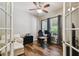 Well-lit office space with French doors, offering a functional workspace with natural light at 13310 Tiger Lilly Ln, Tampa, FL 33625