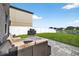 Backyard patio features a seating area with a grill, perfect for outdoor entertaining at 13324 Willow Bluestar Loop, Riverview, FL 33579