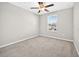 This is a bedroom with neutral carpeting and a view of a neighborhood at 13324 Willow Bluestar Loop, Riverview, FL 33579