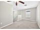 Hallway features carpet floors, neutral walls, and a window that provides natural light at 13324 Willow Bluestar Loop, Riverview, FL 33579