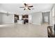 Open-concept living space with tile flooring connecting to the kitchen and entryway at 13324 Willow Bluestar Loop, Riverview, FL 33579