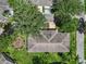 An aerial view showcases the roof and beautiful landscaping at 1617 Leland Dr, Sun City Center, FL 33573