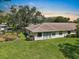Home's backyard featuring a lush lawn and a patio, perfect for outdoor relaxation at 1617 Leland Dr, Sun City Center, FL 33573