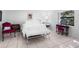 Cozy bedroom with lots of natural light and tile flooring at 1617 Leland Dr, Sun City Center, FL 33573