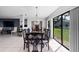 Elegant dining room with a chandelier, dining table and a view of the backyard at 1617 Leland Dr, Sun City Center, FL 33573
