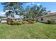 Charming home with well-maintained lawn and landscaping creating a picturesque setting at 1617 Leland Dr, Sun City Center, FL 33573