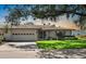 Charming single-story home with a two car garage and well-manicured lawn at 1617 Leland Dr, Sun City Center, FL 33573