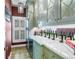 Refined bar area with custom cabinets, wine storage, and a marble countertop at 1628 Long Bow Ln, Clearwater, FL 33764
