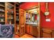 Charming wet bar area with custom cabinetry and a mirrored backsplash at 1628 Long Bow Ln, Clearwater, FL 33764