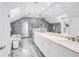Elegant bathroom featuring white marble walls, marble floors, marble vanity top, and soaking tub at 1628 Long Bow Ln, Clearwater, FL 33764