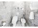 Modern bathroom featuring a toilet, bidet, white marble walls, and accessories at 1628 Long Bow Ln, Clearwater, FL 33764