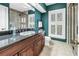Stylish bathroom featuring a glass shower, a dark vanity, and tasteful decor at 1628 Long Bow Ln, Clearwater, FL 33764