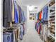 Walk-in closet featuring custom shelving and rod system for organization at 1628 Long Bow Ln, Clearwater, FL 33764