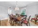 Elegant dining room with hardwood floors, a chandelier, and traditional wooden furniture at 1628 Long Bow Ln, Clearwater, FL 33764