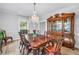 Traditional dining room with hardwood floors, classic furnishings, and natural light at 1628 Long Bow Ln, Clearwater, FL 33764