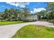 Beautiful home with manicured lawn, brick-paved driveway, lush landscaping and classic curb appeal at 1628 Long Bow Ln, Clearwater, FL 33764