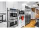 Modern kitchen appliances include built-in oven and microwave, with stainless steel refrigerator at 1628 Long Bow Ln, Clearwater, FL 33764