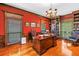 Sophisticated office featuring custom wood built-ins, a large desk, and elegant decor at 1628 Long Bow Ln, Clearwater, FL 33764