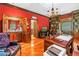 Spacious home office featuring built-in shelving, a wet bar, and herringbone floors at 1628 Long Bow Ln, Clearwater, FL 33764